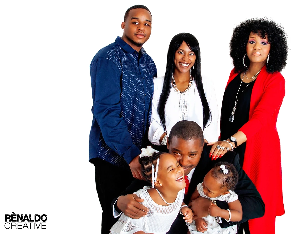 Happy African American family posing for a studio portrait